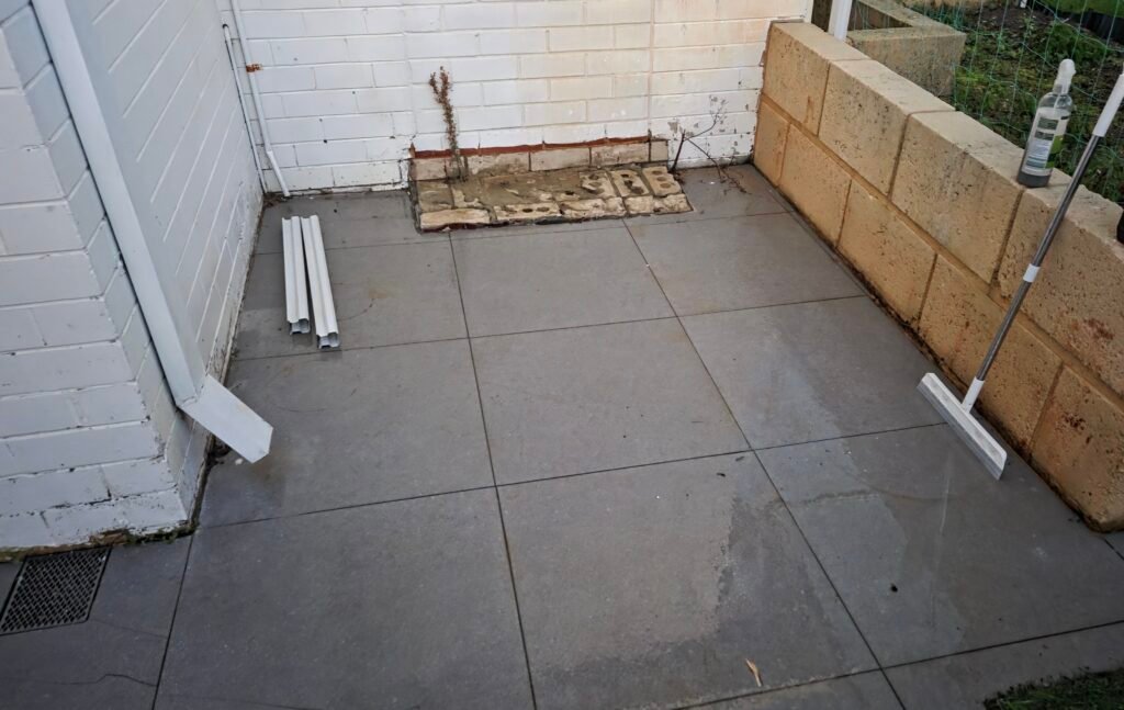 Outdoor patio tiles after rust stain removal and pressure cleaning in Perth